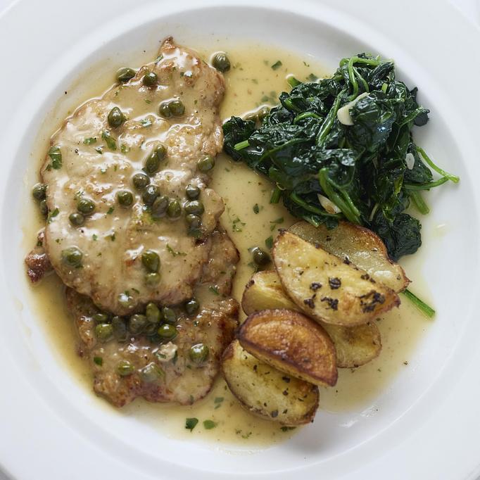Product: Pan-fried and floured veal scallopini topped with white wine and lemon sauce with capers, seasonal vegetables and potatoes - Angelino Restaurant in Sausalito, CA Italian Restaurants