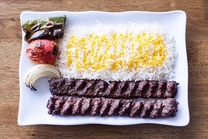 Product: beef koobide is a traditional Persian kabob (ground beef) marinaded with onion and seasoned well, cook on open flame to perfection, served on bed of basmati rice and grilled veggie. - Aiden's Grill in la crescenta / montrose / sunlandtujunga  /goendale - Glendale, CA Mediterranean Restaurants