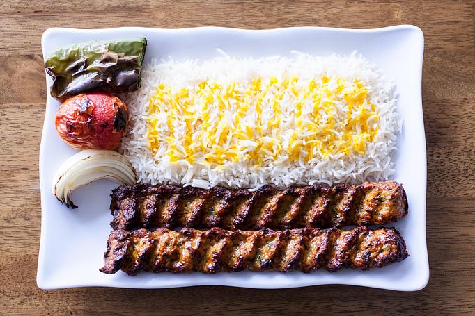Product: Chicken koobide is a traditional Persian kabob (ground Chicken) marinaded with onion and seasoned well, cook on open flame to perfection, served on bed of basmati rice and grilled veggie. - Aiden's Grill in la crescenta / montrose / sunlandtujunga  /goendale - Glendale, CA Mediterranean Restaurants
