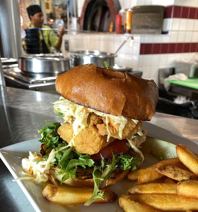 Product: Join the Party with Our Fish Fiesta Sandwich! - Geddy's in Downtown Bar Harbor, just steps from the town pier. - Bar Harbor, ME American Restaurants Product: Join the Party with Our Fish Fiesta Sandwich! - Geddy's in Downtown Bar Harbor, just steps from the town pier. - Bar Harbor, ME American Restaurants