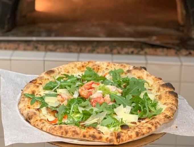 Product: Smoky, spicy, and loaded with fresh lobster - our wood-fired pizza is a flavor explosion. Next level pizza! - Geddy's in Downtown Bar Harbor, just steps from the town pier. - Bar Harbor, ME American Restaurants Product: Smoky, spicy, and loaded with fresh lobster - our wood-fired pizza is a flavor explosion. Next level pizza! - Geddy's in Downtown Bar Harbor, just steps from the town pier. - Bar Harbor, ME American Restaurants