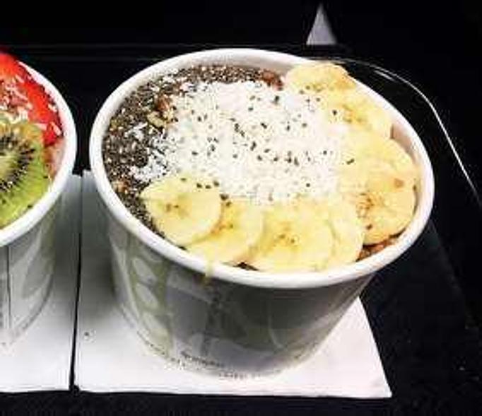 Product: This smoothie bowl combines chocolate and banana with crunchy granola, shredded coconut and chia seeds! - Alkalicious Cold Pressed Juice Bar in Greenbrier East - Chesapeake, VA Organic Restaurants