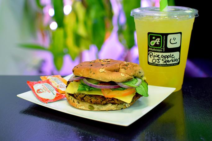 Product: Our homemade black bean burger, with vegan cheese, spinach, tomato, onion and cucumber. - Alkalicious Cold Pressed Juice Bar in Greenbrier East - Chesapeake, VA Organic Restaurants