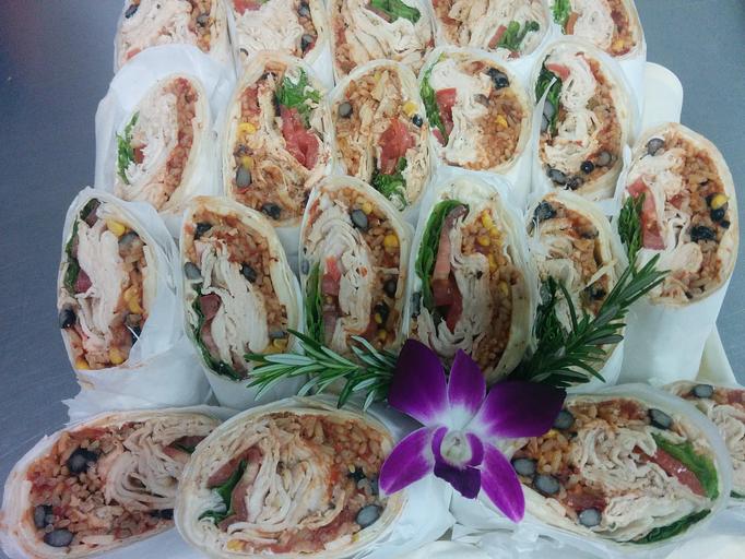 Product: Our Caesar Chavez wrap has our freshly sliced and grilled chicken, black beans, spanish rice, & pepper jack cheese - Asante Catering in Sacramento, CA American Restaurants
