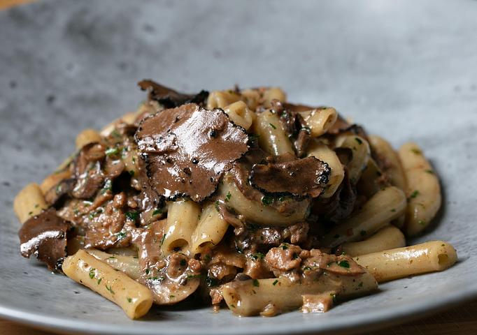 Product: Pork Sausage, roasted Porcini & Crimini mushrooms. Finished with fresh chopped parsley and black summer truffle. - Bello by Sandro Nardone in Newport Beach, CA Bars & Grills