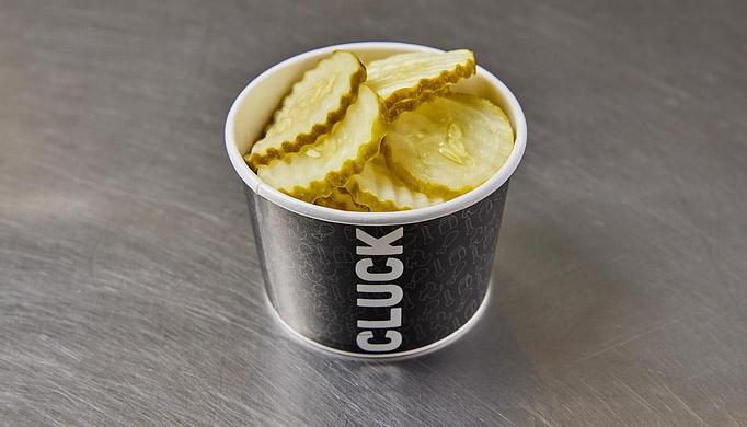 Product: 8 oz of crisp pickles. - Cluck & Blaze in Glendale, CA American Restaurants