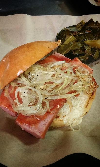 Product: Texas Rope Sausage Sandwich topped with grilled onions and a side of Collard Greens - Deep Run Roadhouse in West End - Richmond, VA Barbecue Restaurants Product: Texas Rope Sausage Sandwich topped with grilled onions and a side of Collard Greens - Deep Run Roadhouse in West End - Richmond, VA Barbecue Restaurants