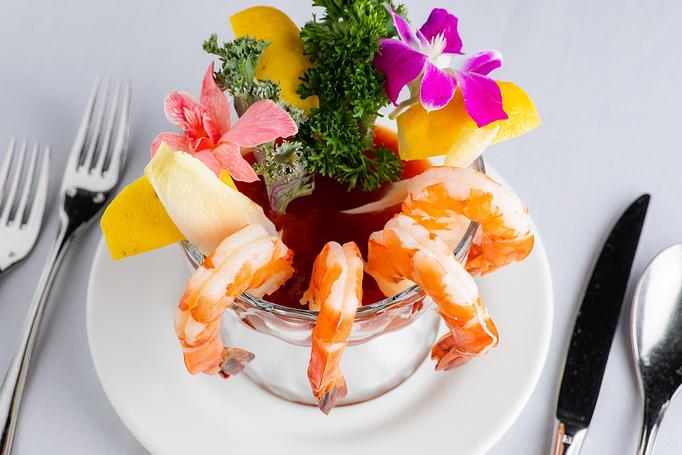 Product: jumbo shrimps, served with lemon wedges and marinara sauce - Empire Steak House in New York, NY Seafood Restaurants