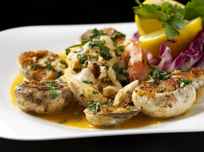 Product: shrimps, stuffed mushrooms and baked clams baked with fresh herbs and spices. - Empire Steak House in New York, NY Seafood Restaurants
