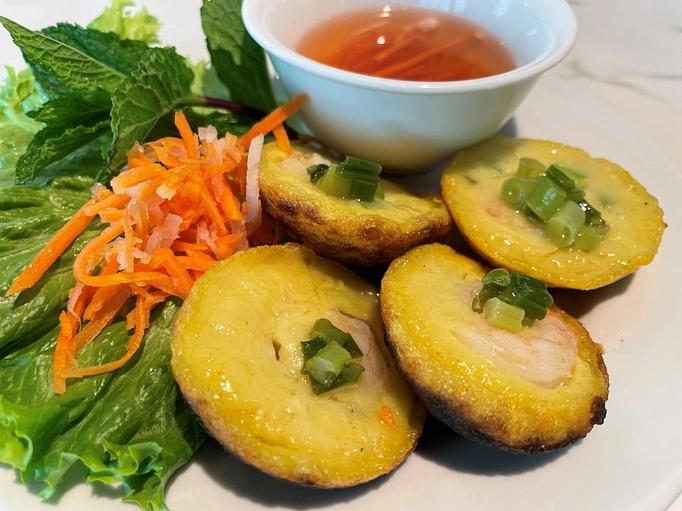 Product: Miniature pancakes served with herbs and vegetables and spicy sweet fish sauce for dipping. - Eurasian Bistro in Argonaut Village - Pensacola, FL Vietnamese Restaurants