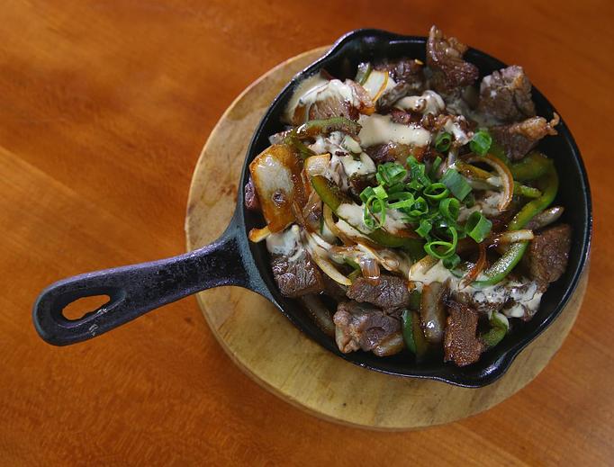 Product: Served Sizzling in a cast iron skillet - Highway Inn Kaka'ako in Kaka'ako - Honolulu, HI Diner Restaurants