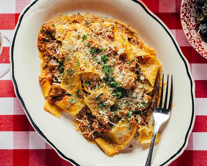 Product: homemade pappardelle tossed with a rich meat ragu of pork shoulder, pork sausage and prime beef, finished with pecorino and parmesan cheese - Il Porcellino in River North - Chicago, IL Italian Restaurants