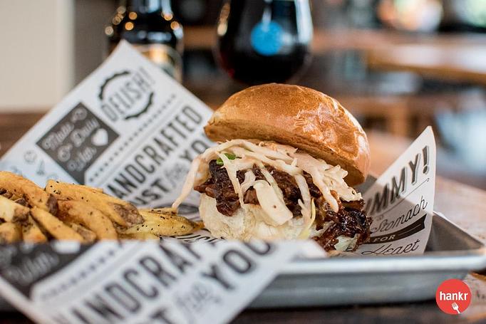 Product: Fox Heritage Farms house-smoked chicken, LBC white sauce, house-made pickles  on your choice of brioche bun or open face on MSDC sourdough - Longtable Beer Cafe in Downtown Middleton - Middleton, WI American Restaurants