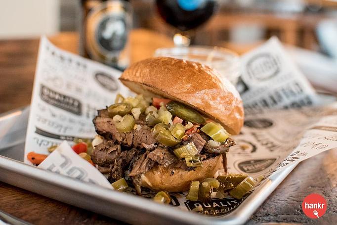 Product: Highland Spring Farm house-smoked, dry-rubbed brisket, giardiniera on  your choice of Clasen’s brioche bun or open face on MSDC sourdough - Longtable Beer Cafe in Downtown Middleton - Middleton, WI American Restaurants