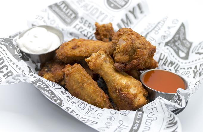 Product: CLASSIC CHICKEN WINGS Hot sauce, bleu cheese dressing, celery - Mill Creek Tavern in Bayville, NY American Restaurants