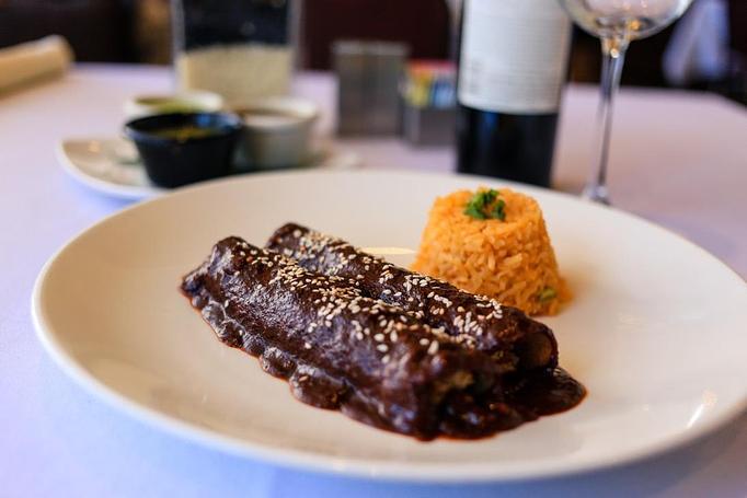 Product: Chicken enchiladas with mole with rice and beans - Oaxaca Mexican Cuisine in Weatherford, TX Mexican Restaurants Product: Chicken enchiladas with mole with rice and beans - Oaxaca Mexican Cuisine in Weatherford, TX Mexican Restaurants