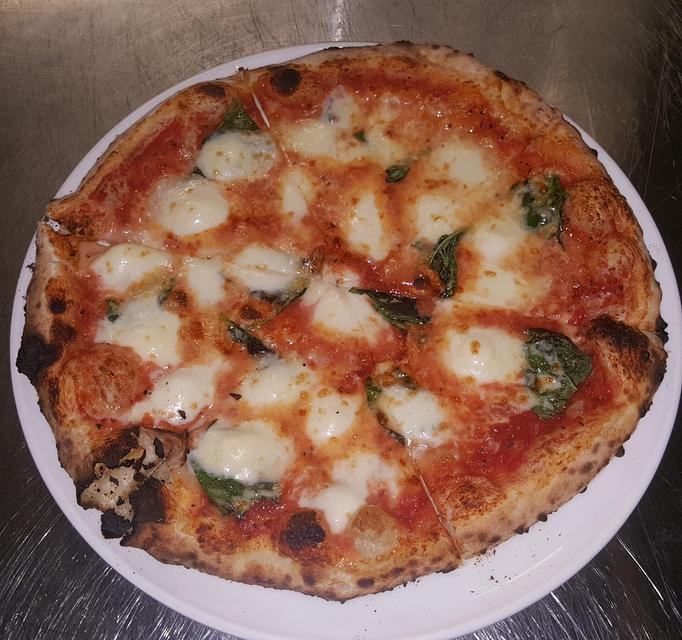 Product: This Neapolitan classic features our made from scratch tomato sauce with fresh
mozzarella & basil - Pazzo Pomodoro in Vienna, VA Italian Restaurants