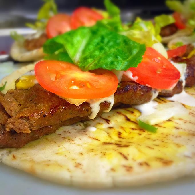 Product: Seasoned ground beef. lettuce, tomatos, onions, cilantro - Rosemary Grill in Los Angeles, CA Mediterranean Restaurants