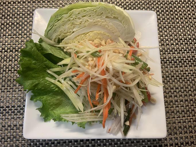 Product: Shredded green papaya prepared with chopped green bean, tomatoes, unsalted roasted peanuts, chili, garlic, and lime juice - Siam Queen Thai Bistro in Carlsbad, CA Thai Restaurants