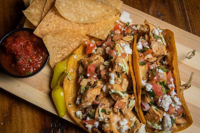 Product: Grilled Chicken Adobo tacos with avocado cilantro crema, cotija cheese, and pico. Served with a side of chips and fire roasted salsa. - Steven in Mesa, AZ American Restaurants