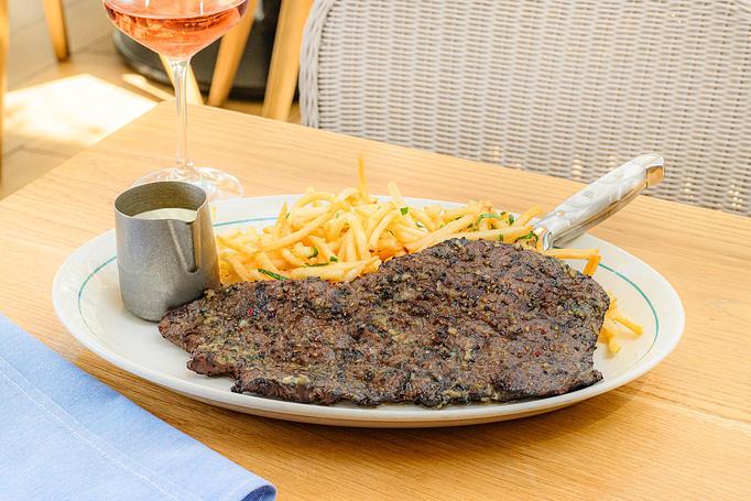 Product: all natural brandt beef skirt steak with herb butter served with garlic fries, and bearnaise sauce on the side - Summer House - Las Vegas in Las Vegas, NV Restaurants/Food & Dining