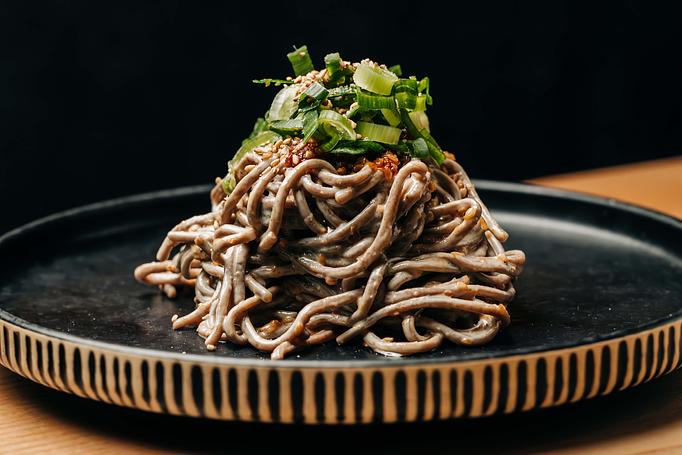 Product: chilled japanese buckwheat noodles tossed in gomae dressing and finished with garlic chili vinaigrette and negi. - Sushi San - Reservations in River North - Chicago, IL Japanese Restaurants