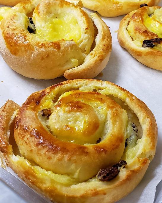 Product: Our Pain Aux Raisins pairs the classic pastry cream and raisin filling with our fluffy and lightly sweet brioche. - The Back Door Bakery & Cafe in Sunland, CA American Restaurants
