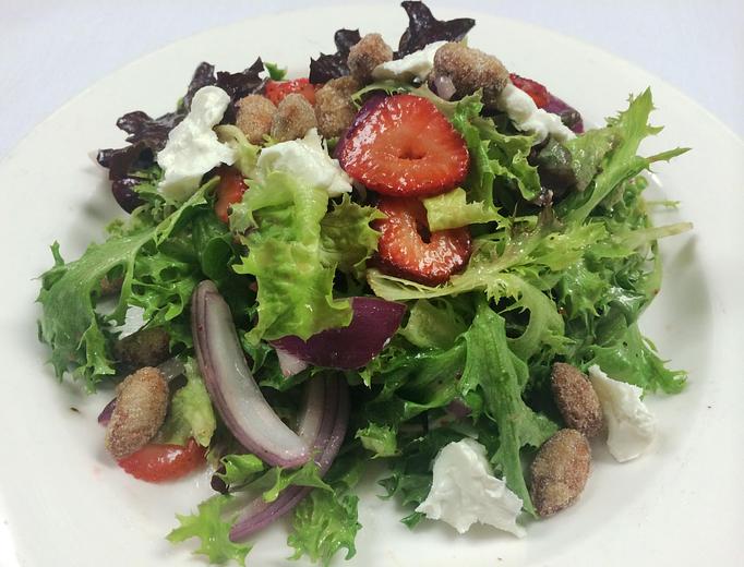 Product: Mixed Greens with Champagne Vinaigrette, Goat Cheese, Fresh Berries & Candied Almonds - The Caboose Restaurant in Located in Beautiful Downtown McComb - McComb, MS Cajun & Creole Restaurant