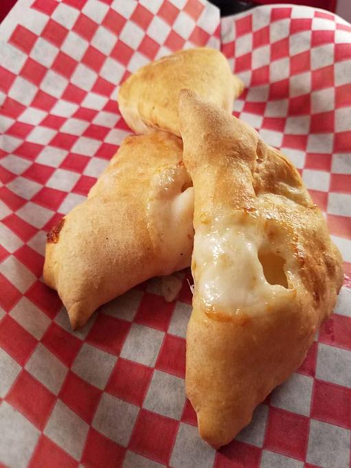 Product: Cheese Puffins are like mini Calzones made from 100% natural products and all natural Mozzarella Cheese.  Kids are sure to love this. - Townies Pizzeria in Fernandina Beach, FL Italian Restaurants