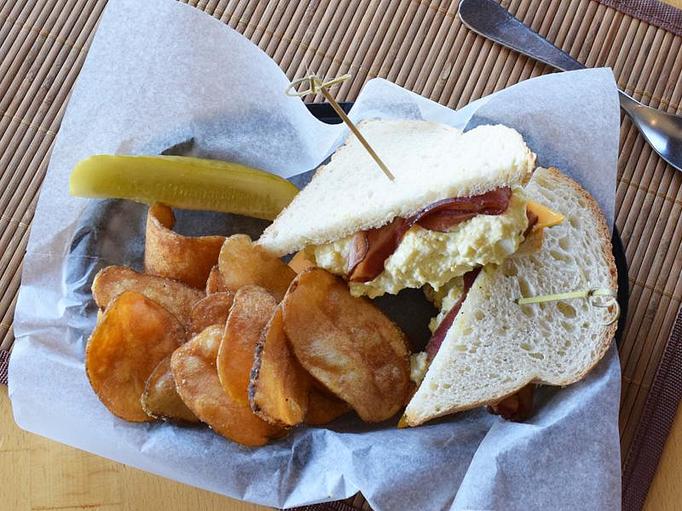 Product: Egg Salad Deluxe - With Nueske's bacon and cheddar cheese on your choice of bread - West Allis Cheese & Sausage Shoppe in West Allis, WI Coffee, Espresso & Tea House Restaurants
