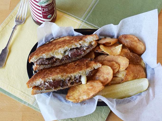 Product: Grilled Roast Beef - With caramelized onion, garlic mayo, blue cheese on white bread - West Allis Cheese & Sausage Shoppe in West Allis, WI Coffee, Espresso & Tea House Restaurants