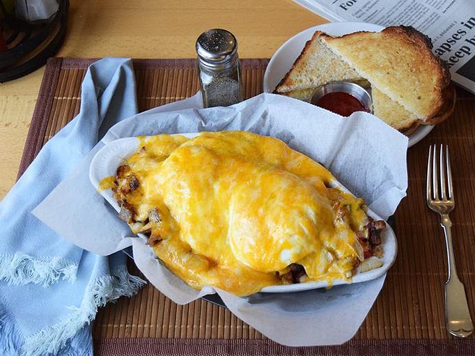 Product: Breakfast Skillet Deluxe - eggs your way, sausage, bacon, potatoes, red & green peppers, onion, mushroom, three cheese blend - West Allis Cheese & Sausage Shoppe in Milwaukee, WI Meat Products