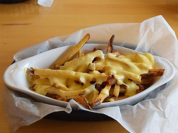 Product: Cheese Fries - fries topped with our homemade cheese sauce - West Allis Cheese & Sausage Shoppe in Milwaukee, WI Meat Products