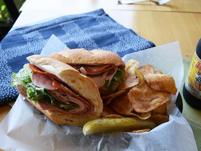 Product: Italian - mortadella, capicola, salami, ham, pepperoni, provolone cheese, olive tapenade, lettuce, mayo on white bread - West Allis Cheese & Sausage Shoppe in Milwaukee, WI Meat Products