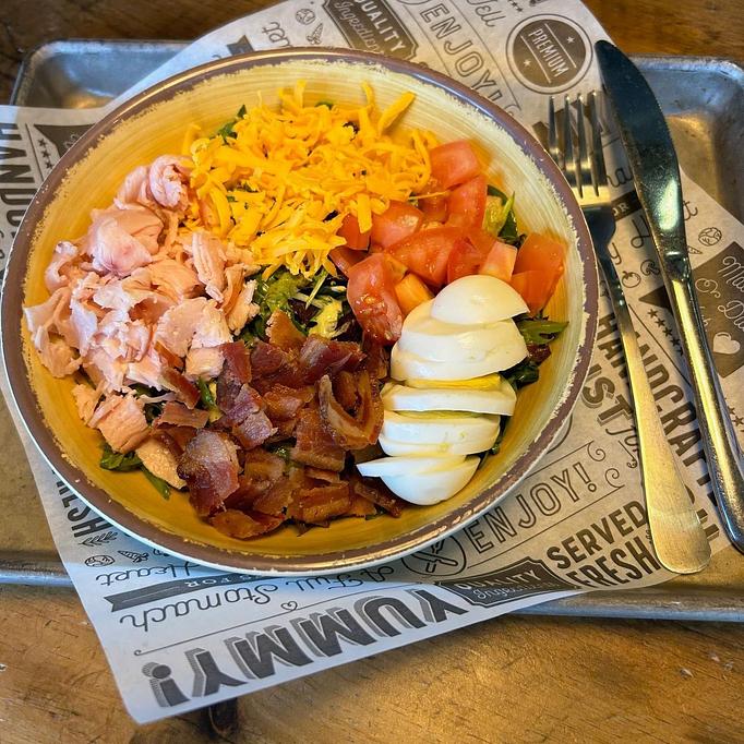 Product: Mixed greens, spinach, smoked turkey, bacon crumbles, tomato, hard-boiled egg, cheddar cheese, Green Goddess dressing - Longtable Beer Cafe in Downtown Middleton - Middleton, WI American Restaurants
