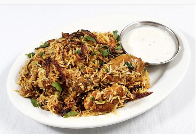 Product: CHICKEN MADE WITH FRESH MILD SPICYS PAN FREID OVER BASMATI RICE SERVED WITH RAITA - Aangan Nepalese and Indian Cuisine in Albany, CA Indian Restaurants