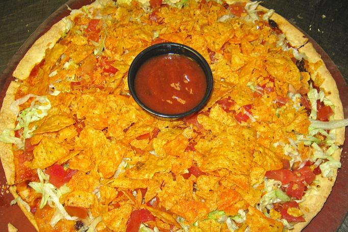 Product: Topped with lettuce, tomatoes & taco chips! - Buffalo Phil's Pizza & Grille in The Waterpark Capital of the World- Wisconsin Dells! - Wisconsin Dells, WI American Restaurants