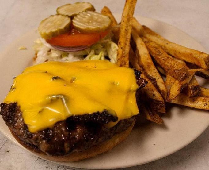 Product: 1/2 lb patty Classic American Hamburger - Charlie Brown's Neighborhood Bar & Grill in San Antonio, TX American Restaurants