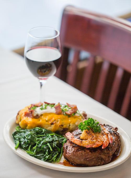 Product: Shown topped w/grilled shrimp, twice baked potato & spinach. - Eugene's Gulf Coast Cuisine in Houston, TX Seafood Restaurants