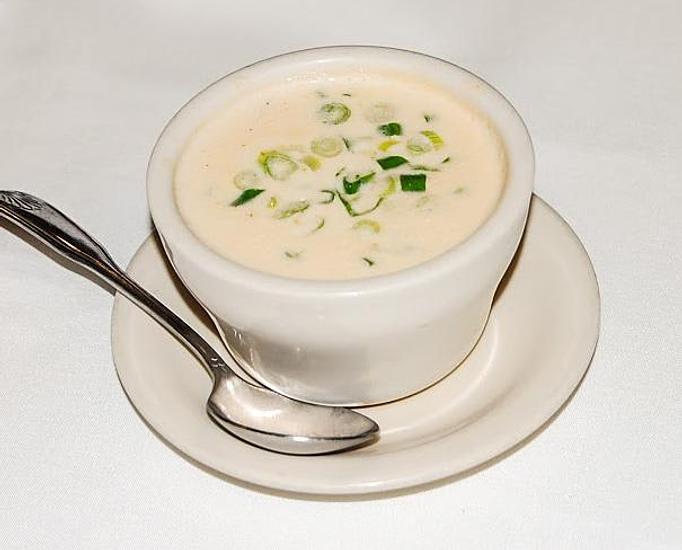 Product: Fresh cut sweet corn, jumbo lump crabmeat, and green onion in a cream based soup - Eugene's Gulf Coast Cuisine in Houston, TX Seafood Restaurants