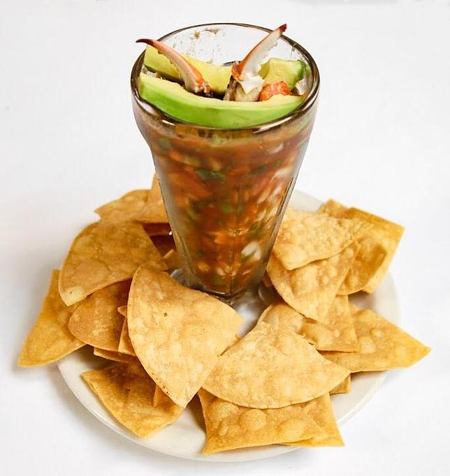 Product: A Mexican style seafood cocktail with shrimp, crab claws, & avocado. Served with House made tortilla chips. - Eugene's Gulf Coast Cuisine in Houston, TX Seafood Restaurants