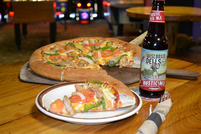 Product: With a bottle of our Rustic Red beer! - Moosejaw Pizza in The Waterpark Capital of the World in Wisconsin Dells! - Wisconsin Dells, WI American Restaurants