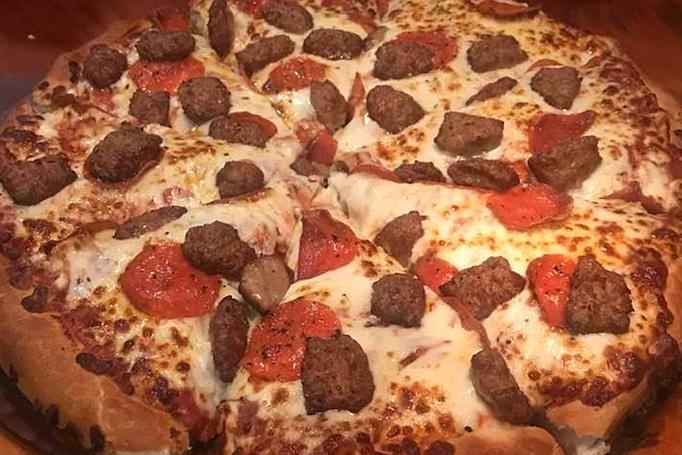 Product: Add toppings to a 14" cheese pizza, choose thin or thick crust. - Moosejaw Pizza in The Waterpark Capital of the World in Wisconsin Dells! - Wisconsin Dells, WI American Restaurants Product: Add toppings to a 14" cheese pizza, choose thin or thick crust. - Moosejaw Pizza in The Waterpark Capital of the World in Wisconsin Dells! - Wisconsin Dells, WI American Restaurants