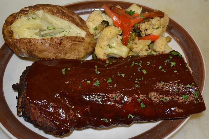 Product: Half rack portion of baby back ribs - Moosejaw Pizza in The Waterpark Capital of the World in Wisconsin Dells! - Wisconsin Dells, WI American Restaurants