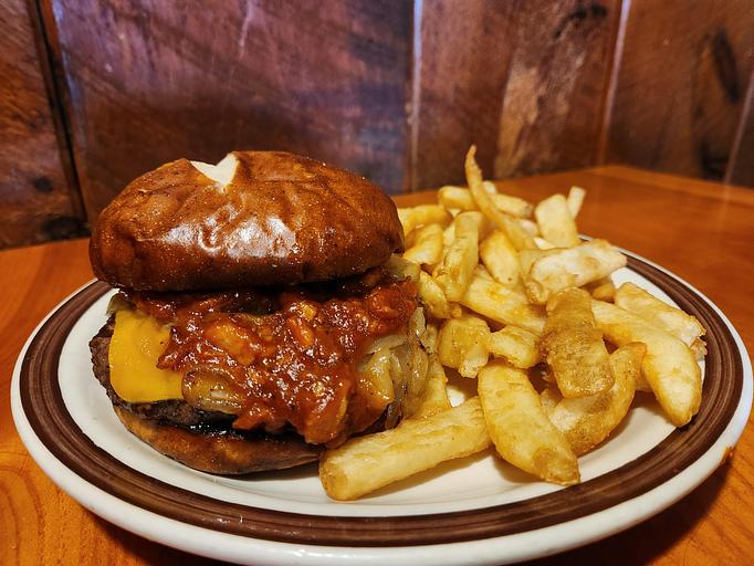 Product: Topped with our homemade Maple Bacon Jam, caramelized onions & cheddar cheese - Moosejaw Pizza in The Waterpark Capital of the World in Wisconsin Dells! - Wisconsin Dells, WI American Restaurants