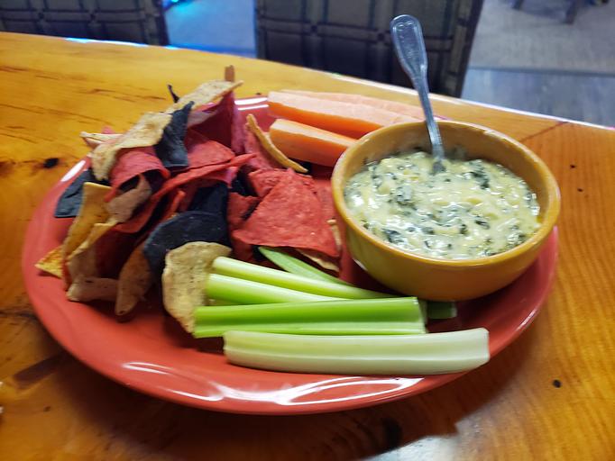 Product: Served with carrots, celery & seasoned tortilla chips - Moosejaw Pizza in The Waterpark Capital of the World in Wisconsin Dells! - Wisconsin Dells, WI American Restaurants