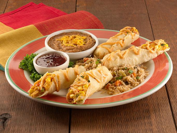 Product: Lightly crisped hand-rolled flour tortillas filled with seasoned shredded chicken, roasted red and poblano peppers, grilled corn with mild Cheddar and Monterey Jack cheese. Served with our jalapeño jelly sauce for dipping. - Paradiso Mexican Restaurant in Bismarck, ND Mexican Restaurants