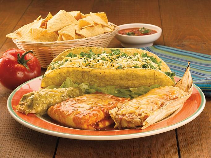 Product: A hand-rolled chicken enchilada, a crispy taco loaded with beef, a home-style chile relleno filled with fresh poblano peppers and Cheddar and Monterey Jack cheese and a savory home-style chicken tamale made with stone ground corn masa. - Paradiso Mexican Restaurant in Bismarck, ND Mexican Restaurants