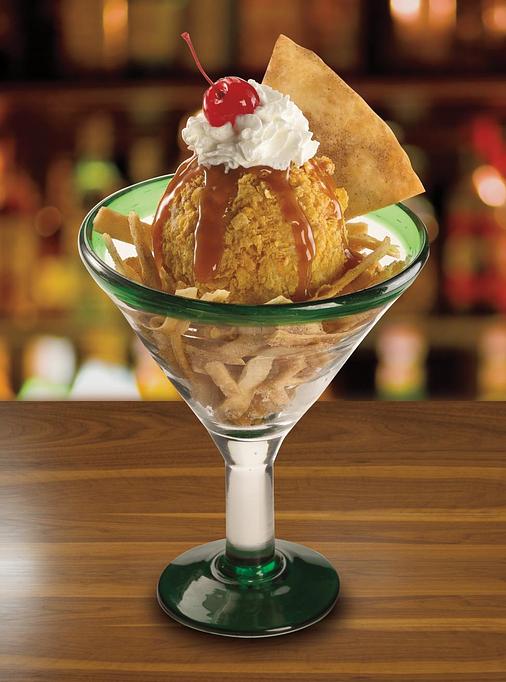 Product: What a treat! Cool French vanilla ice cream rolled in a sweet coating and deep-fried until crunchy. - Paradiso Mexican Restaurant in Bismarck, ND Mexican Restaurants