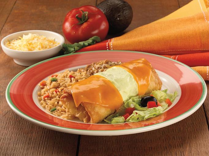 Product: Tender shredded beef or chicken and creamy fundido sauce makes this chimi a great choice. We add a hint of jalapeño, top it off with melted Monterey Jack and Cheddar cheese and serve it with Spanish rice and your choice of beans. - Paradiso Mexican Restaurant in Fargo, ND Mexican Restaurants